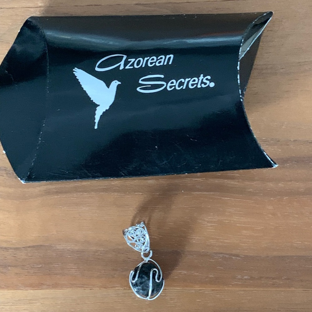 New sterling filigree encompassing a piece of Azorean black lava. Unique!